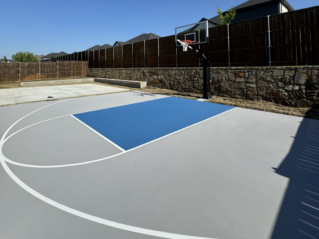 A basketball court with a blue and white color scheme.