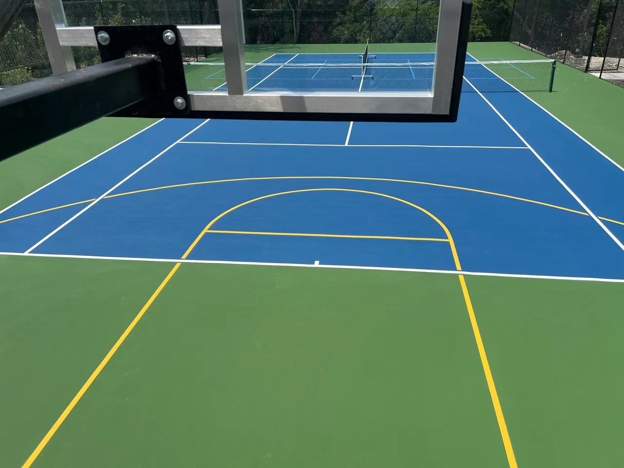 A basketball court with two different colors of blue and yellow.